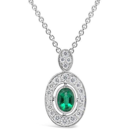 oval emerald and diamond halo pendant