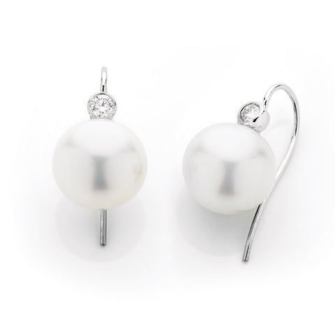 white South Sea pearl and bezel set diamond earrings with hook fitting